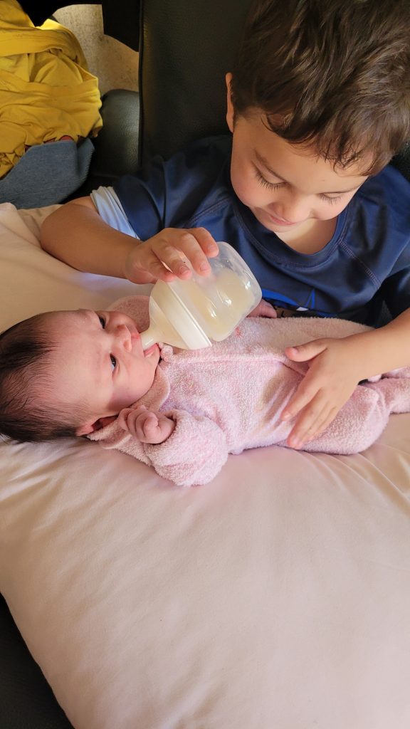 Nasir Feeding Aisha her First Bottle