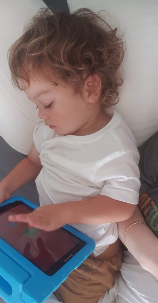 Nasir figuring out how to use his tablet