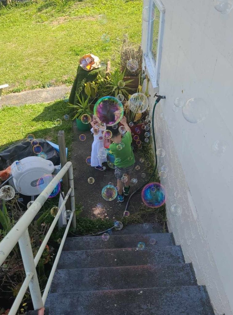 The Middle Child Playing with the Younger Child.